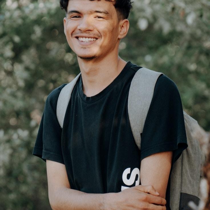 Alex Morgan, Lead Design Curator at Tranquil Wave Hub, reviewing corporate floral arrangements